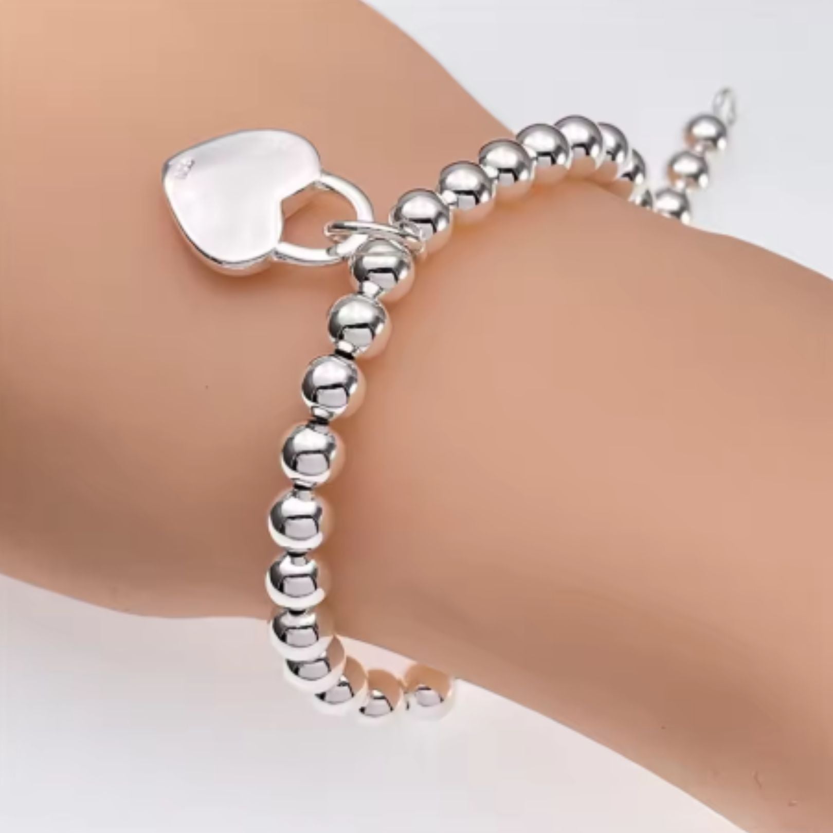 wearing the heart charm bead bracelet in stirling silver 925